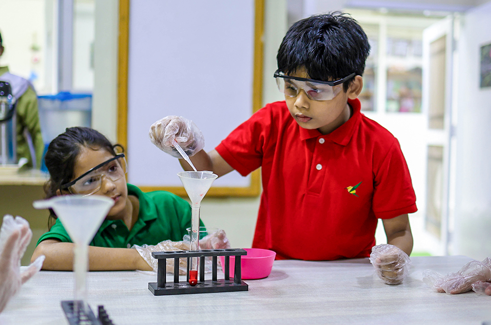 Children experimenting with a structure they have built